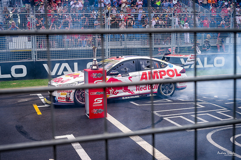 2022 Supercars champion Shane van Gisbergen does a burnout around thetrophy at the end of the last race for the season