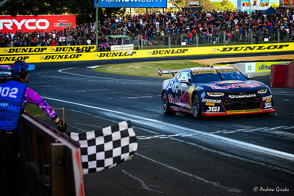 2024. Second place, Broc Feeney passes the checkered flag.